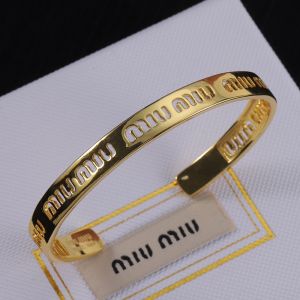 Miu Miu Cuff Bracelet With Cut-Out Logo In Metal Gold