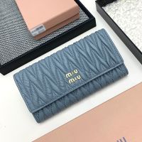 Miu Miu Large Flap Bifold Wallet In Matelasse Nappa Leather Navy Blue