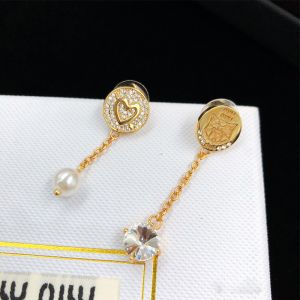 Miu Miu Asymetrical Earrings With Pearl Crystal Pendant In Metal Gold