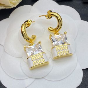 Miu Miu Earrings With Large Crystal Logo In Metal Gold/White