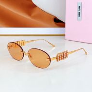 Miu Miu SMU 5693TS Oval Sunglasses With Strass Logo In Metal Orange