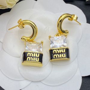 Miu Miu Earrings With Large Crystal Logo In Metal Gold/Black